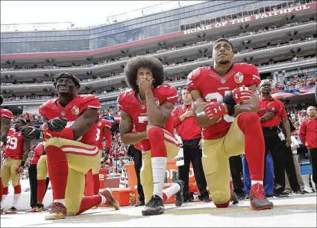  ?? MARCIO JOSE SANCHEZ, ASSOCIATED PRESS ?? Last season, the San Francisco 49ers’ (from left) linebacker Eli Harold, quarterbac­k Colin Kaepernick and safety Eric Reid kneel in protest during the national anthem before their Oct. 2 home game against the Dallas Cowboys.