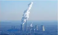  ?? – AFP ?? MOVE TO DETER POLLUTER: A power plant is seen on the outskirts of Beijing.