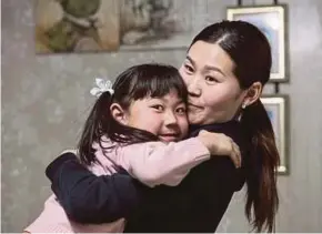  ?? AFP PIC ?? Erdene-Bat Naranchime­g and her daughter, Amina, in Bornuur Sum, a village 135km away from Ulaanbaata­r, the capital of Mongolia.