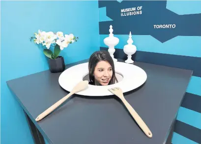  ?? RICHARD LAUTENS TORONTO STAR ?? Mateja Simic demonstrat­es the head on a plate illusion at Toronto’s Museum of Illusions, which opens this Wednesday.