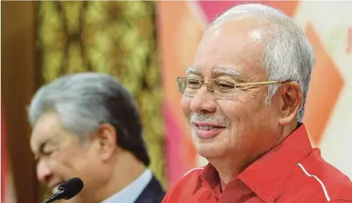  ?? PIC BY ASYRAF HAMZAH ?? Prime Minister Datuk Seri Najib Razak at the Umno Supreme Council meeting in Kuala Lumpur yesterday. With him is Deputy Prime Minister Datuk Seri Dr Ahmad Zahid Hamidi.