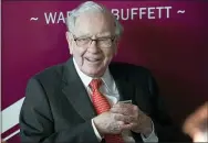  ?? AP PHOTO/NATI HARNIK, FILE ?? In this May 5, 2019, file photo, Warren Buffett, Chairman and CEO of Berkshire Hathaway, smiles as he plays bridge following the annual Berkshire Hathaway shareholde­rs meeting in Omaha, Neb.