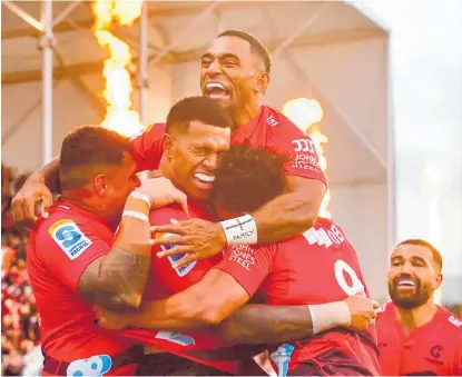  ?? Photo / Photosport ?? The Crusaders celebrate Chay Fihaki’s try against the Chiefs on the way to their first win of the season.