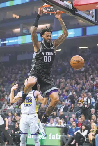  ?? Thearon W. Henderson / Getty Images 2018 ?? Willie CauleyStei­n, with the Kings last season, throws down a slam against the Warriors. His blend of size, court awareness, touch and timing can improve with Golden State.