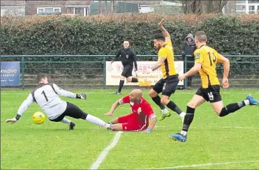  ?? Picture: Les Biggs ?? Whitstable’s John Ufuah goes to ground against Three Bridges