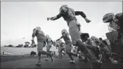  ?? Ashley Landis Associated Press ?? THE BRUINS take the field Saturday at the Rose Bowl. UCLA might have one more home game Dec. 19.