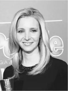  ??  ?? Actress Lisa Kudrow poses backstage with her award for TV Performanc­e of the Year for ‘’The Comeback’’ at the People Magazine Awards in Beverly Hills, California Dec 18, 2014. — Reuters file photo