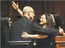  ??  ?? Lt. Gov. Susan Bysiewicz hugs her husband, David, after being sworn in at the Capitol in Hartford on Wednesday.