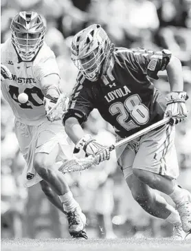  ?? JOHN MCCREARY/LOYOLA MARYLAND ATHLETICS ?? Bailey Savio wins a first-quarter faceoff for Loyola Maryland against Penn State’s Gerard Arceri on Sunday in their quarterfin­al matchup.