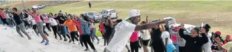  ?? Picture: ZAMANDULO MALONDE ?? ACTION MAN: Luyolo Tandani leads the crowd at a Zwide keep-fit class