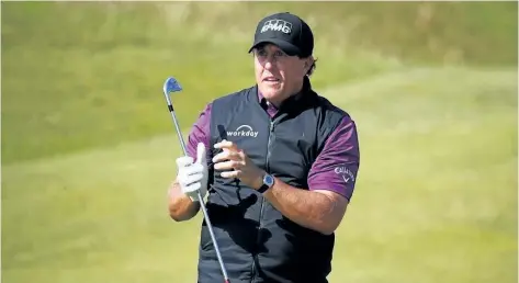  ?? GREGORY SHAMUS/GETTY IMAGES ?? Phil Mickelson watches his approach shot on the 8th hole during a practice round on Tuesday prior to the 146th Open Championsh­ip at Royal Birkdale in Southport, England.