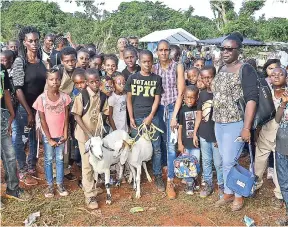  ??  ?? Teacher Celia Pryce (front, right) with students and staff of Free Hill Primary and Infant School in St Mary, pose with their prize goats on November 8.