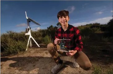  ?? PHOTOS BY PAUL RODRIGUEZ — FOR THE ORANGE COUNTY REGISTER ?? Ryan Honary, 14, in Newport Coast, holds a remote wildfire sensor he developed.