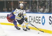  ?? The Associated Press ?? Buffalo Sabres defenseman Jake McCabe controls the puck during the second period of a Feb. 7, 2020, game against the New York Rangers in New York. For the teams that missed the 2020 playoffs, they’ve spent the past 10 months waiting for the compressed 56-game 2021 season.