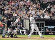  ?? JEFF HAYNES] ?? Minnesota's Nelson Cruz watches a two-run homer during a recent game against the Chicago White Sox. Cruz, who played minor league ball with the Oklahoma City RedHawks, had a three homer game last week. [AP PHOTO/