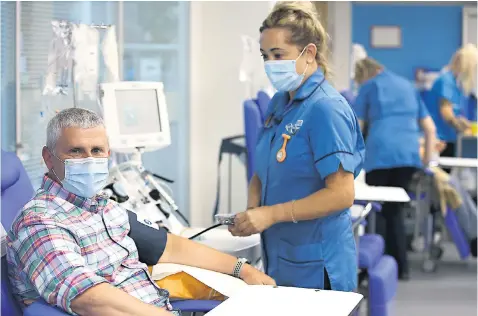  ??  ?? A patient donates blood for trials to see whether plasma from survivors of Covid-19 can be used to treat patients whose immune systems are struggling to fight the virus