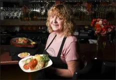  ?? REBECCA SLEZAK — SPECIAL TO THE DENVER POST ?? Chef Jutta Dellert with a dish of golabki.