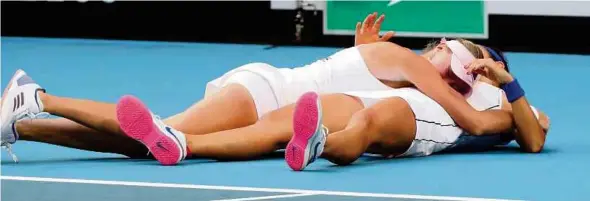  ?? EPA PIC ?? Caroline Garcia (right) and Kristina Mladenovic of France celebrate winning the doubles match against Ashleigh Barty and Samantha Stosur of Australia in the Fed Cup final yesterday.