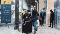  ?? THIBAULT CAMUS THE ASSOCIATED PRESS ?? Passengers arrive with the first train arriving from Britain after Brexit on Friday at the Gare du Nord railway station, in Paris.