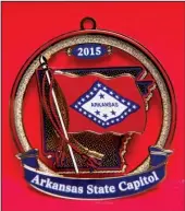  ?? Photo courtesy of Arkansas secretary of state ?? The 2015 Arkansas State Capitol Christmas ornament features the state flag. Capitol ornaments, issued through the secretary of state’s office, are an 11-year tradition.