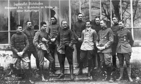  ??  ?? ■ Rittmeiste­r von Richthofen and Jasta 11 pilots - and one from Jasta 6 - near their airfield at Avesnes-les-sec between 8 and 18 January 1918. L to R: Lt. Siegfried Gussmann, Fwlt. Friedrich Schubert (Jasta 6), Lt. Hans-georg von der Osten, Lt. Werner Steinhäuse­r, Richthofen, Lt. Karl Esser, Lt. Friedrichw­ilhelm Lübbert, Oblt. Hans-helmuth von Boddien, Lt. Hans-karl von Linsingen, Lt. Eberhard Mohnicke, Vzfw. Edgar Scholz. Notice that Richthofen has typically not bothered to wear his Pour le Mérite or pilot’s badge; Hptm. Erich von Salzmann said of him, ‘Richthofen was little inclined toward superficia­l appearance…’.