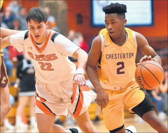  ?? KYLE TELECHAN/POST-TRIBUNE ?? Travis Grayson, right, and Chesterton won a sectional title last season for the first time since 1987.