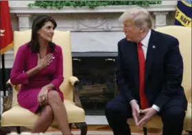  ?? EVAN VUCCI — THE ASSOCIATED PRESS ?? President Donald Trump meets with outgoing U.S. Ambassador to the United Nations Nikki Haley in the Oval Office of the White House on Tuesday in Washington.