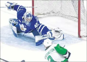  ?? CP PHOTO ?? Toronto Marlies goaltender Garret Sparks (40) makes a save on Texas Stars defenceman Dillon Heathering­ton (3) during second period AHL Calder Cup playoff action in Toronto on Thursday.