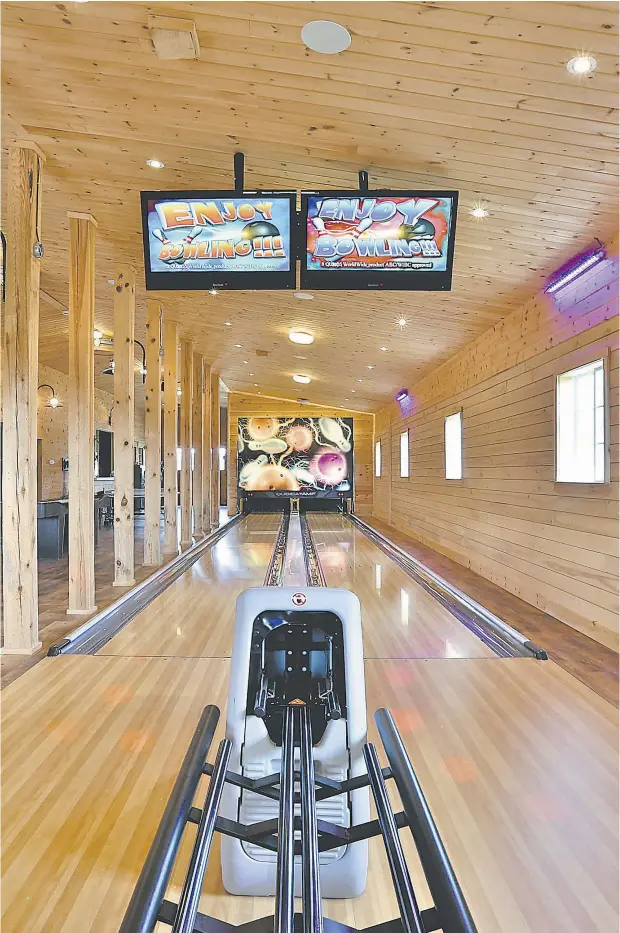  ?? HANDOUT ?? The dual bowling lanes are just one part of the property’s 5,000-sq.-ft. entertainm­ent
complex.