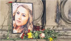  ?? FILIP DVORSKI THE ASSOCIATED PRESS ?? Bulgarian police are investigat­ing the slaying of Viktoria Marinova, whose body was dumped near the Danube River after she reported on the possible misuse of European Union funds in Bulgaria.