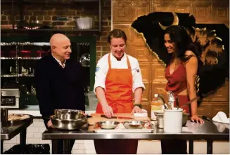  ?? CONTRIBUTE­D BY BRAVO ?? Bravo’s “Top Chef” almost picked Atlanta for season 14 but instead opted for Charleston, S.C. Shown here are judges Tom Colicchio (left) and Padma Lakshmi (right) with contestant Emily Hahn.