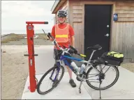  ?? Keith Gallinelli / Contribute­d photo ?? Tim Bezler, a Fairfield resident, using the bike pump installed at Southport Beach.