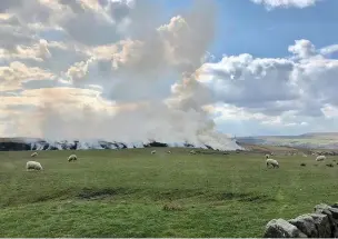  ?? Image: LFRS ?? The controlled burn on moorland near Rossendale School down Branford Road, Edenfield