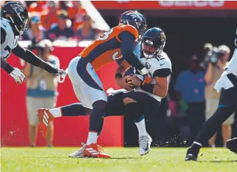  ?? Eric Lutzens, The Denver Post ?? Broncos outside linebacker Von Miller sacks Jacksonvil­le Jaguars quarterbac­k Gardner Minshew during the first quarter on Sunday.