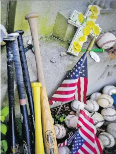  ?? SETH WENIG/THE ASSOCIATED PRESS ?? Items left by visitors decorate the grave of George Herman (Babe) Ruth and Claire Ruth at the Gate of Heaven Cemetery in Hawthorne, N.Y.