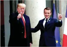  ?? AP PHOTO/THIBAULT CAMUS ?? French President Emmanuel Macron, right, and U.S. President Donald Trump give a thumbs-up at the Elysee Palace in Paris on Saturday.