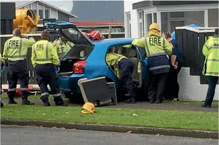  ?? PHOTOS: KRIS BOULT/STUFF ?? One of the three cars involved in the crash ended up smashing into the Westbury’s fence.