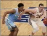  ?? JEFF ROBERSON - THE ASSOCIATED PRESS ?? Loyola of Chicago’s Cameron Krutwig, right, dribbles as Indiana State’s Tre Williams defends during the second half of an NCAA college basketball game in the semifinal round of the Missouri Valley Conference men’s tournament Saturday, March 6, 2021, in St. Louis.