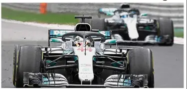  ?? — AFP ?? All yours: Mercedes’ Lewis Hamilton (left) steers his car ahead of teammate Valtteri Bottas to win the Russian Grand Prix at the Sochi Autodrom Circuit in Sochi yesterday.