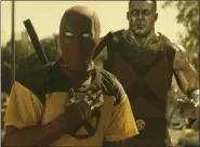  ?? TWENTIETH CENTURY FOX ?? Deadpool, played by Ryan Reynolds, and Colossus, voiced by Stefan Kapicic, appear a scene from “Deadpool 2.”