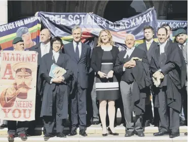  ??  ?? 0 Sergeant Alexander Blackman’s wife Claire with his lawyers and supporters outside the court