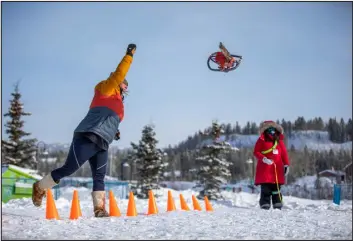  ?? ?? A competitor in the chain-saw-chucking event at Yukon Rendevous, an annual festival in the Yukon capital of Whitehorse, Canada, in February 2023.