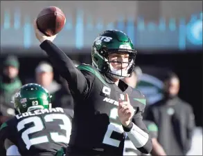  ?? Bill Kostroun / Associated Press ?? New York Jets quarterbac­k Zach Wilson passes during the first half against the Philadelph­ia Eagles last Sunday.