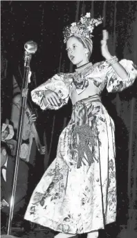  ??  ?? Swinging her hips to a Latin rhythm in February 1951 is this turbaned little replica of Carmen Miranda — pretty Sonja Bailey of Peabody School. Sonja was one of the entries in a Kiwanis Club-sponsored party at Linden Circle Theater for Safety Council patrol members. RUDOLPH VETTER / THE COMMERCIAL APPEAL