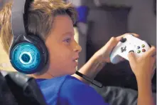  ?? MARTHA IRVINE/ASSOCIATED PRESS ?? Henry Hailey, 10, plays the online game Fortnite in the early morning hours in the basement of his Chicago home. His parents are on a quest to limit screen time for him and his brother.