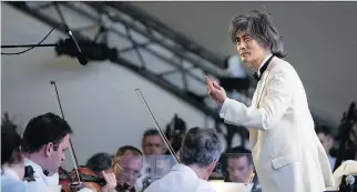  ?? ALLEN McINNIS/ MONTREAL GAZETTE ?? A performanc­e outside a stadium — such as the one staged by the OSM and Kent Nagano on Wednesday — is an imperfect way to hear most classical music. .