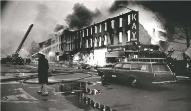  ?? WASHINGTON POST FILE PHOTO ?? Storefront­s were ablaze in the aftermath of the 1968 riots on Washington’s H Street.