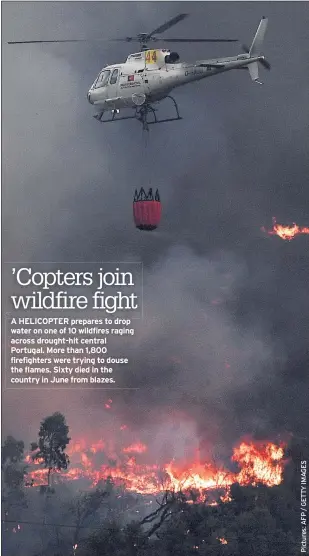  ??  ?? A HELICOPTER prepares to drop water on one of 10 wildfires raging across drought-hit central Portugal. More than 1,800 firefighte­rs were trying to douse the flames. Sixty died in the country in June from blazes.