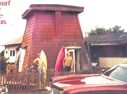  ?? COURTESY OF MARIE CRUZ ?? One summer in the early 1970s, author Elliott Almond lived in a water tower in Capitola-by-the-Sea. Almond, left, was getting ready for a paddle out with his friend, the former Don Carroll, a well-known Santa Cruz surfer and mountain biker.