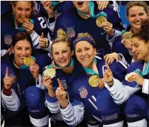 ?? BRUCE BENNETT / GETTY IMAGES ?? The gold-medal winning United States women’s hockey team celebrates Wednesday after defeating Canada in a shootout at the PyeongChan­g 2018 Winter Olympic Games.